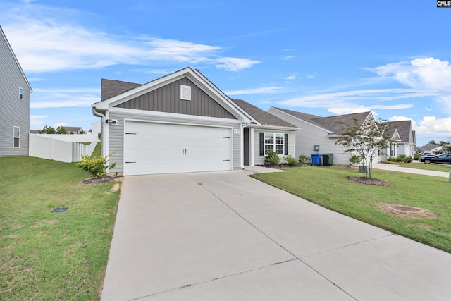 view of front of property featuring a garage and a front lawn