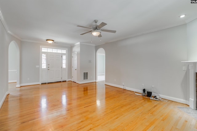 entryway featuring crown molding, ceiling fan, and light hardwood / wood-style floors