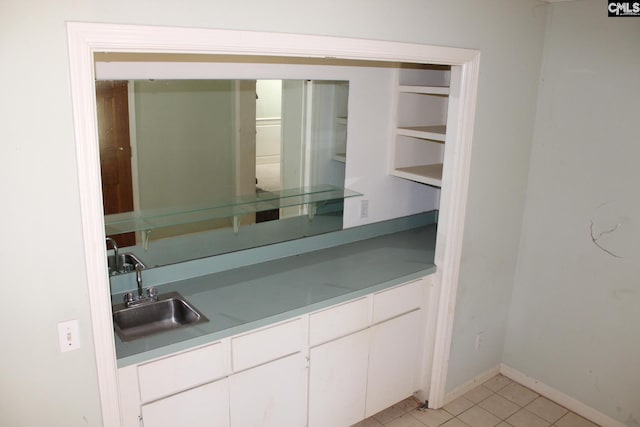 interior space with tile patterned flooring and sink