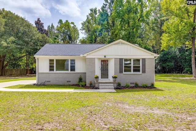 ranch-style home with a front lawn