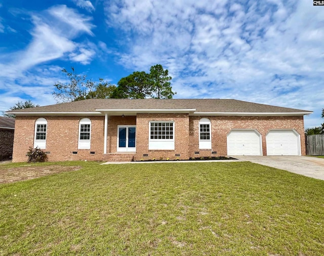 ranch-style home featuring a front yard and a garage