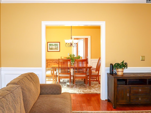 dining area featuring a chandelier and hardwood / wood-style floors