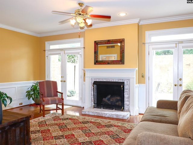 living room featuring french doors, hardwood / wood-style flooring, and a wealth of natural light