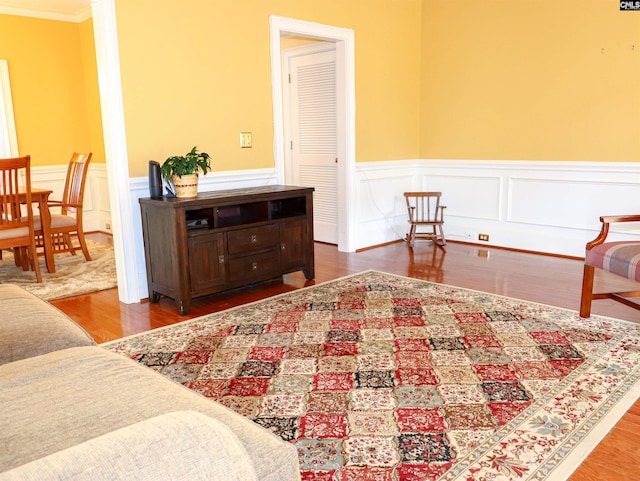 bedroom featuring ornamental molding and hardwood / wood-style floors