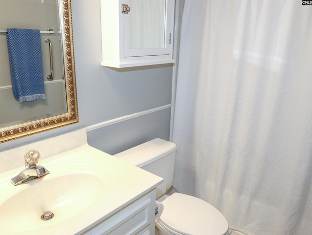 bathroom featuring vanity and toilet