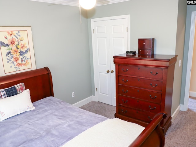 carpeted bedroom featuring ornamental molding