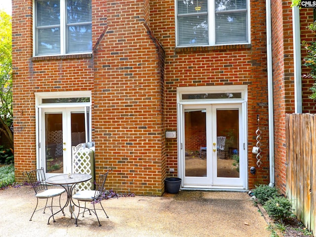 rear view of property featuring french doors and a patio