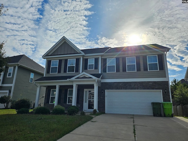 view of front facade with a front yard and a garage