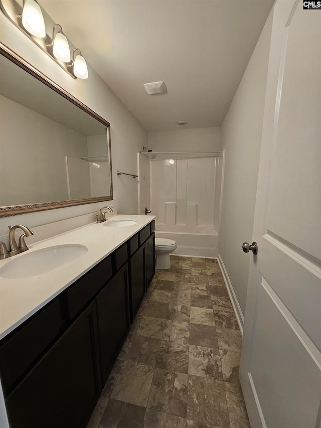 full bathroom with vanity,  shower combination, and toilet