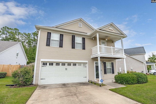 view of front of home with a balcony, a garage, and a front lawn