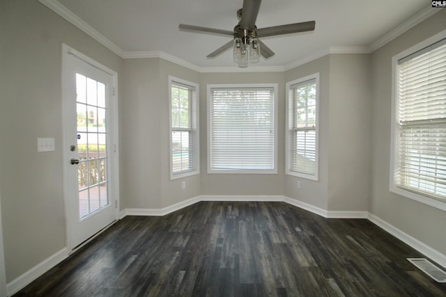 spare room featuring ornamental molding, ceiling fan, and dark wood-type flooring