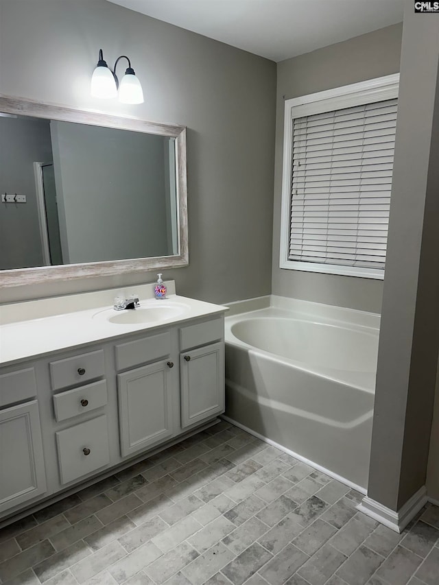 bathroom with vanity and a bathtub