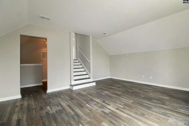 bonus room with vaulted ceiling and dark hardwood / wood-style floors