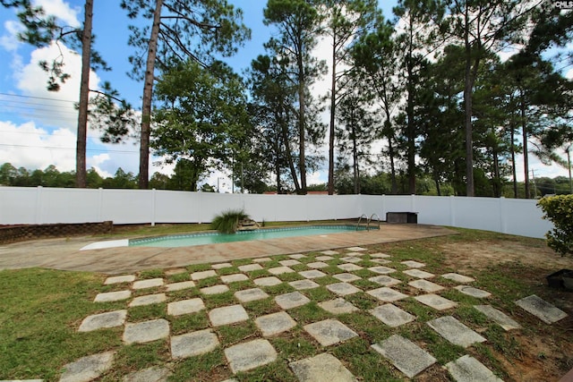 view of pool with fence and a patio area
