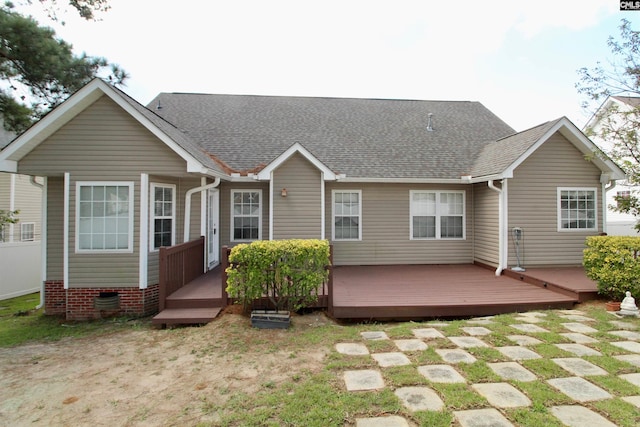 back of house with a wooden deck