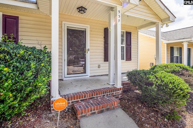 property entrance with covered porch