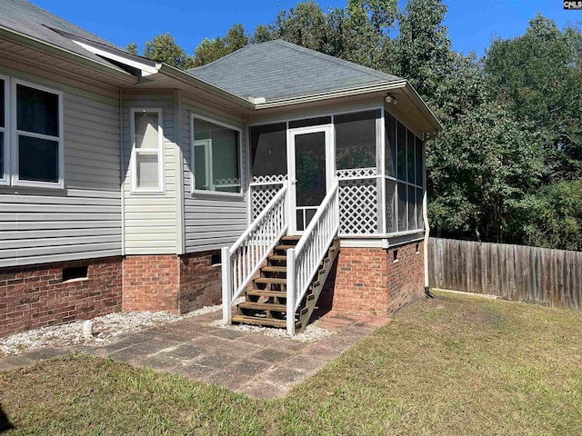 entrance to property with a yard