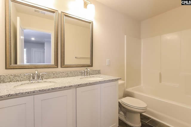 full bathroom featuring tile patterned flooring, vanity, toilet, and shower / bathing tub combination