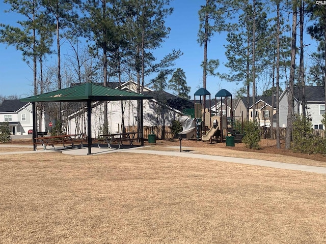 surrounding community featuring a playground and a yard