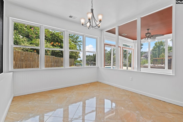 unfurnished sunroom with ceiling fan with notable chandelier