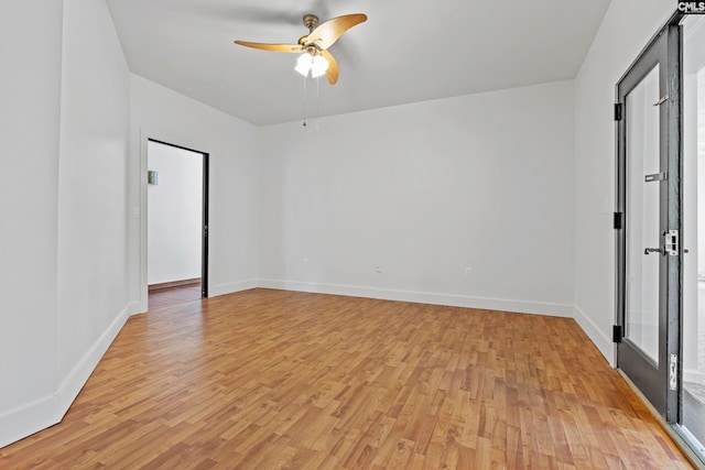 unfurnished room featuring light hardwood / wood-style floors and ceiling fan