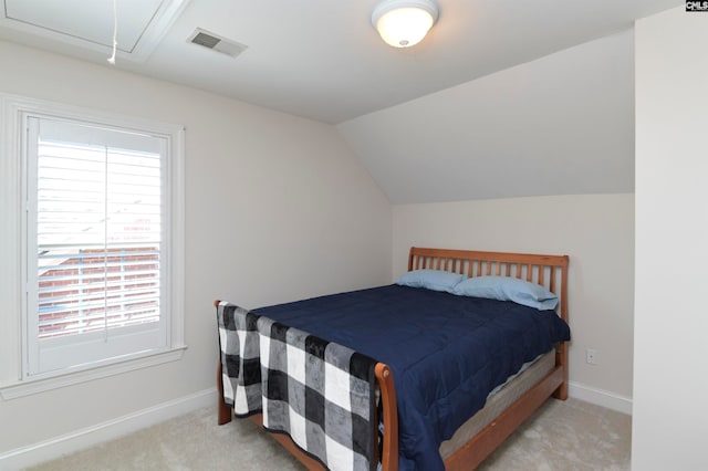 carpeted bedroom featuring vaulted ceiling