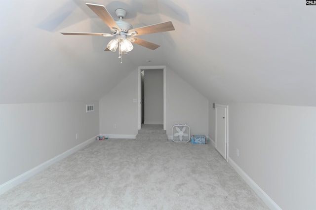 bonus room with light carpet, vaulted ceiling, and ceiling fan