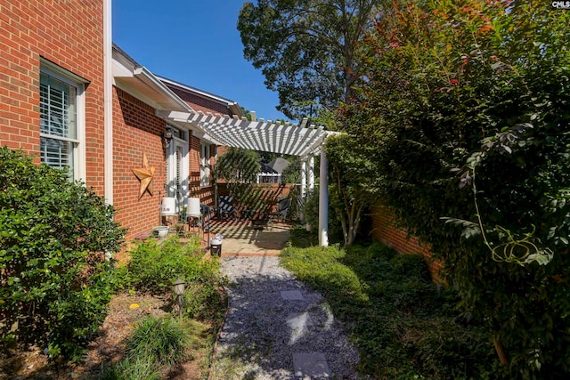 exterior space with a pergola and a patio area