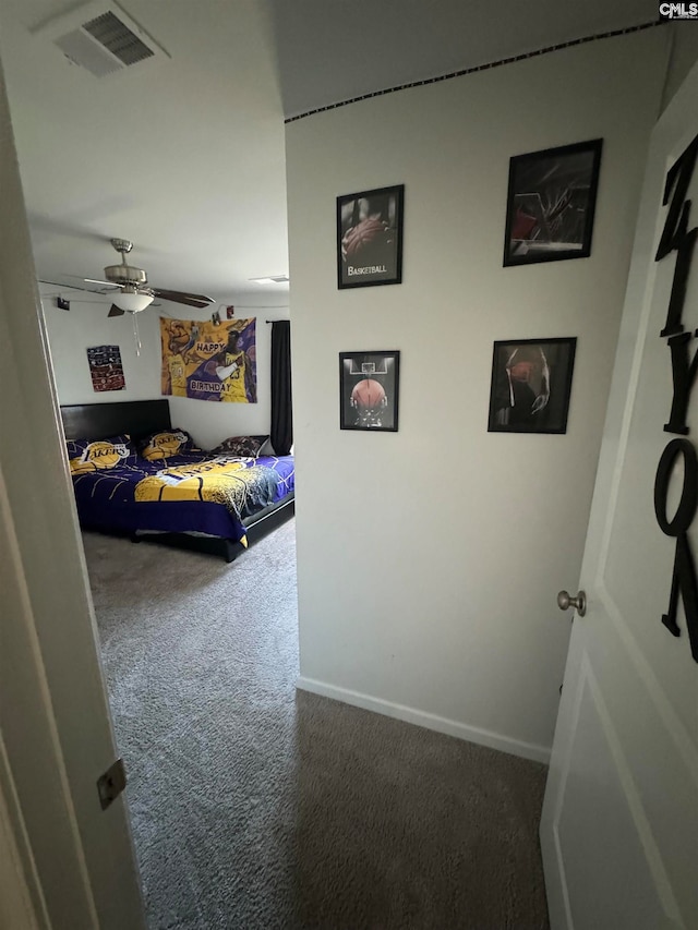 carpeted bedroom with ceiling fan