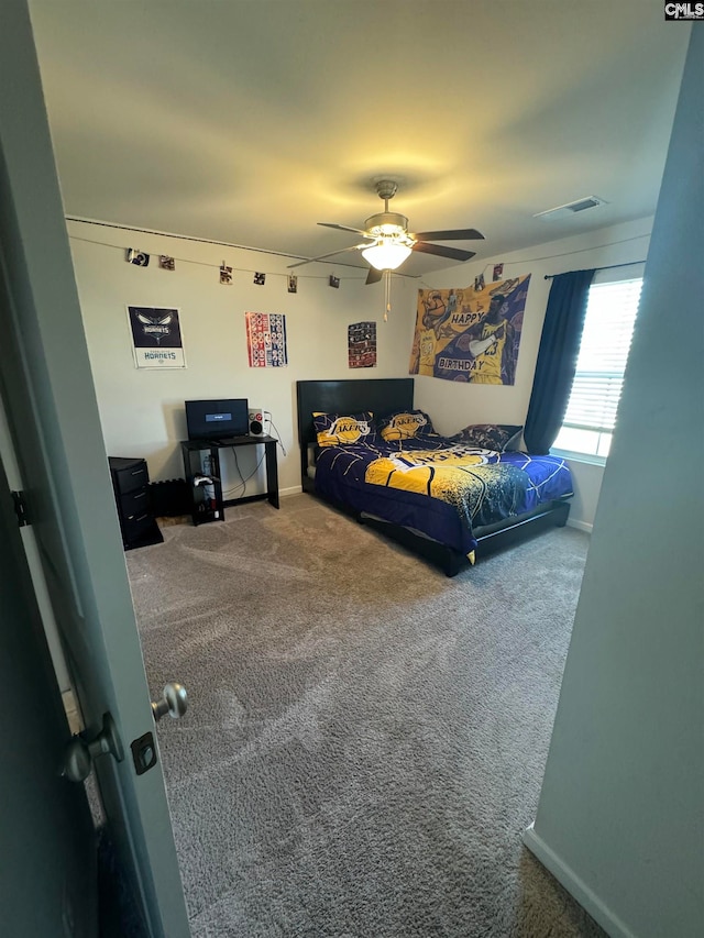 carpeted bedroom featuring ceiling fan