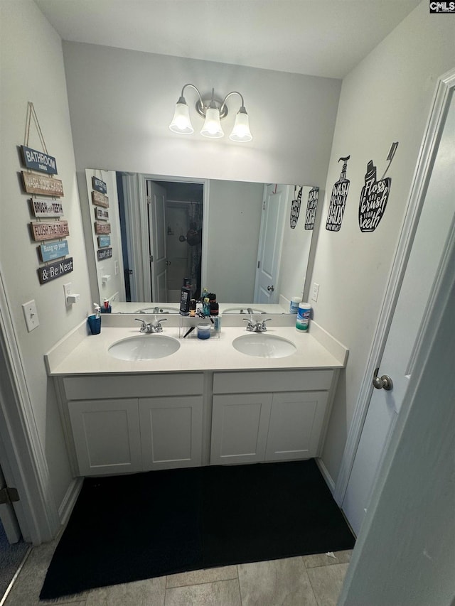 bathroom with tile patterned flooring and vanity