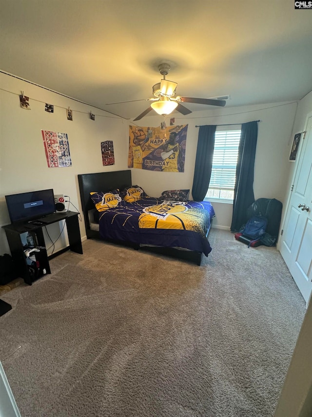 bedroom with ceiling fan and carpet