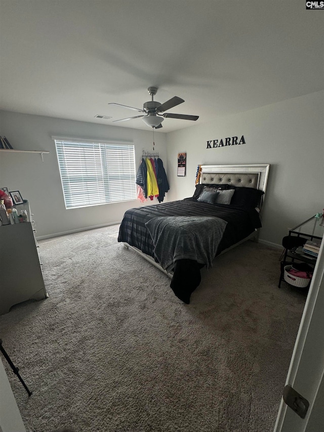 carpeted bedroom featuring ceiling fan