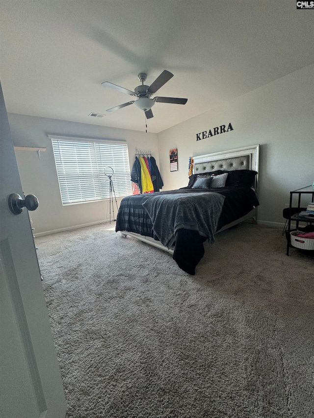 carpeted bedroom with ceiling fan