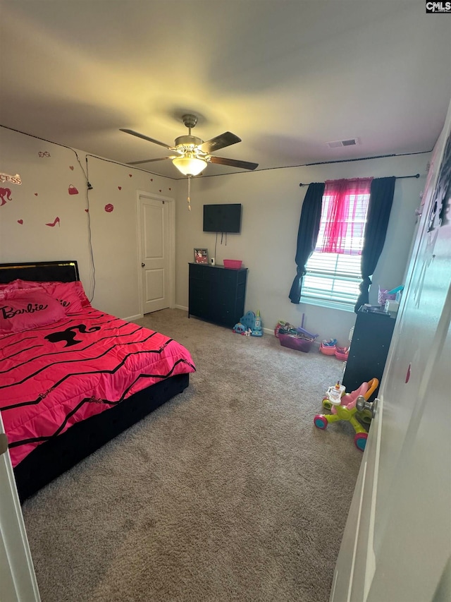 bedroom with ceiling fan and carpet