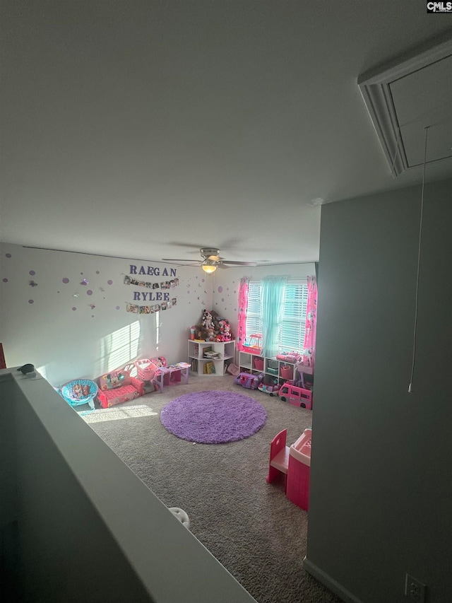 rec room with carpet floors and ceiling fan