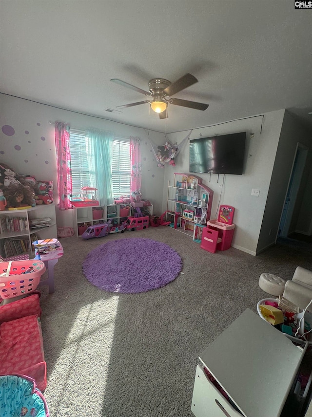 recreation room featuring carpet floors and ceiling fan