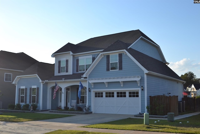 view of front of house featuring a garage and a front lawn