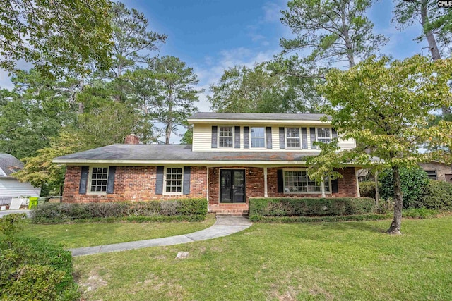 front facade with a front yard