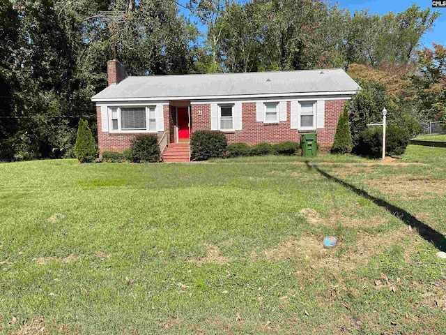 single story home featuring a front yard