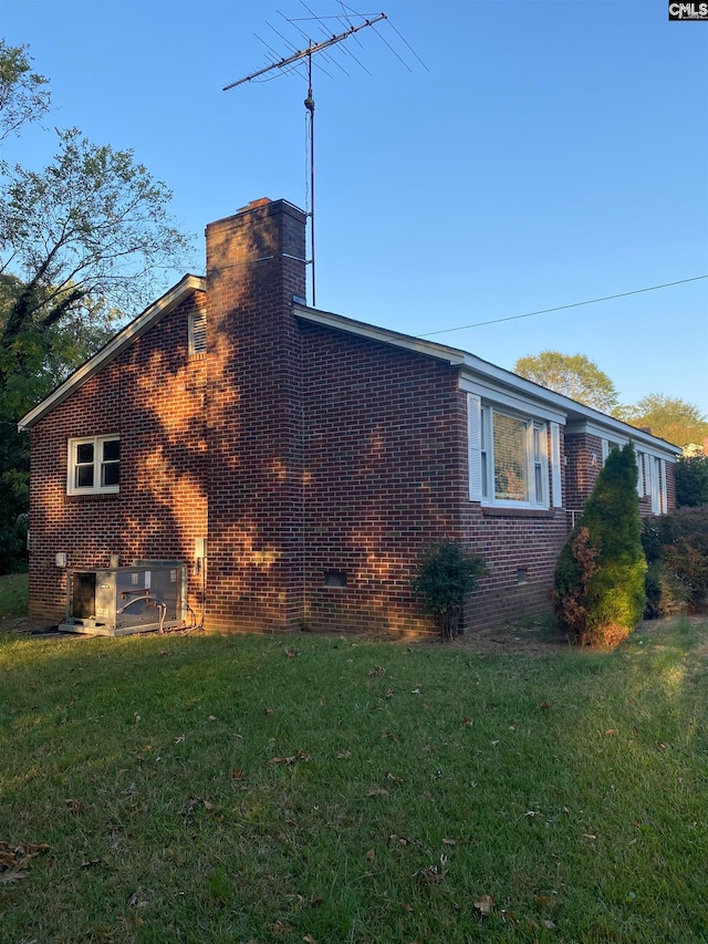 view of property exterior featuring a yard