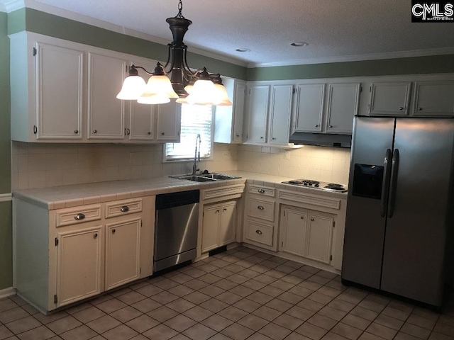 kitchen featuring pendant lighting, white cabinets, appliances with stainless steel finishes, and sink