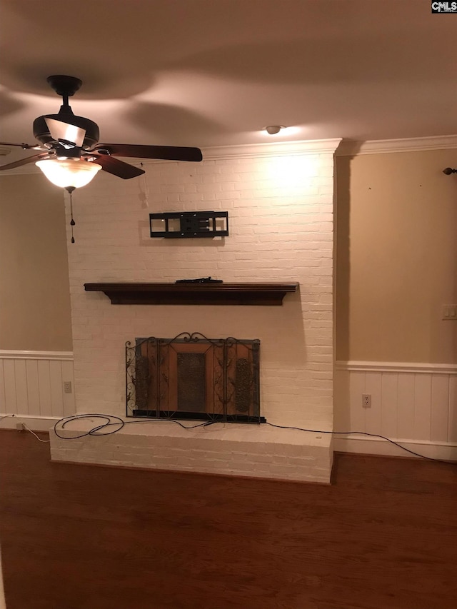 unfurnished living room with wood-type flooring, crown molding, and ceiling fan