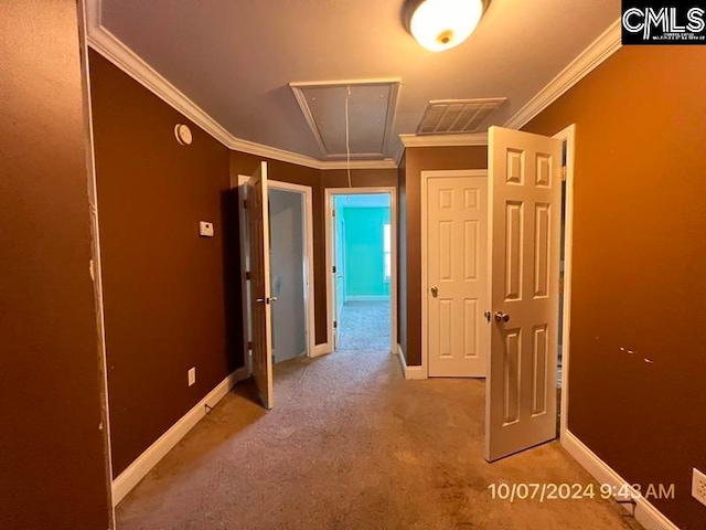 hall featuring light carpet and crown molding