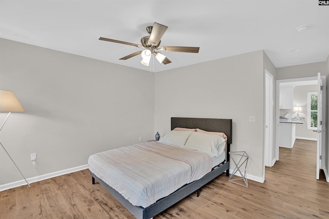 bedroom with light wood-type flooring and ceiling fan