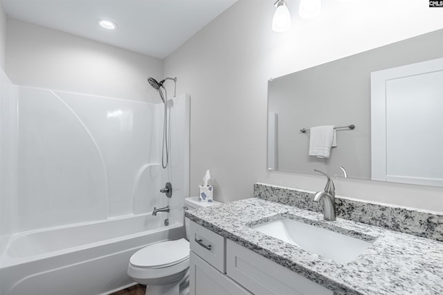 full bathroom with vanity, bathtub / shower combination, and toilet