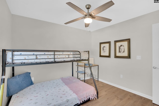 bedroom featuring ceiling fan and hardwood / wood-style floors