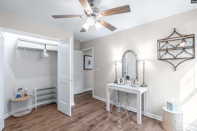 bedroom with wood-type flooring, a closet, and ceiling fan