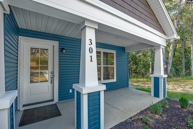 property entrance with covered porch