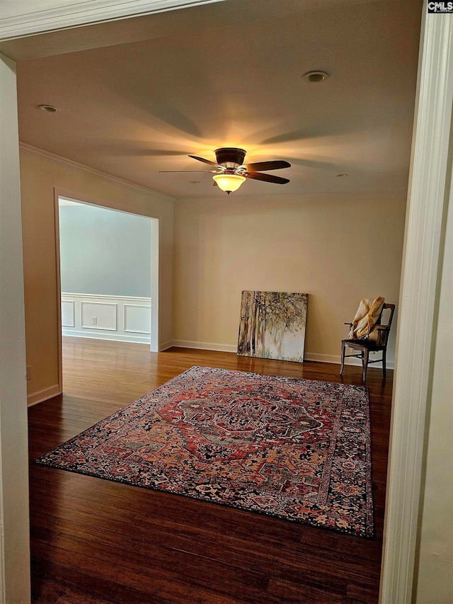 hall with ornamental molding and wood-type flooring